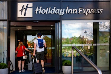 People enter the Holiday Inn Express hotel in Arnhem, Netherlands May 2, 2024.