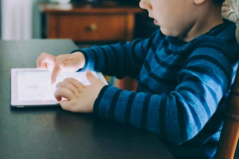 Research suggests all the time kids spend on screens and social media contributes to anxiety. - Unsplash