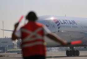 A passenger plane arrives at the Arturo Merino Benitez International Airport, in Santiago, Chile May 26, 2020.