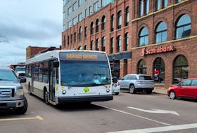 A city transit bus pulls away from the stop in front of the Confederation Centre of the Arts on Grafton Street on May 1. Charlottetown is considering removing some parking space to expand its transit depot on this street. Logan MacLean • The Guardian