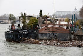 Debris and waste are pictured in the Seine River as the level of river has exceeded the 4-meter mark in Paris, France, March 11, 2024.