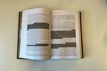 A handout photo of a Roberto Carnero's book "Pasolini: Dying for One's Own Ideas" about the openly gay Italian film director Pier Paolo Pasolini, published by Russian publisher "AST", with text fragments censored in compliance with the Russian law on "LGBT propaganda". AST/Handout via REUTERS