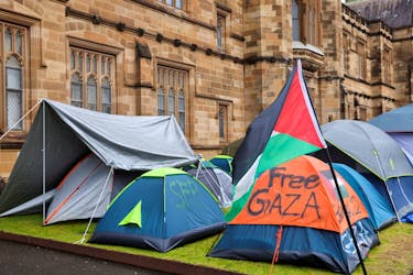 A Palestinian flag flutters next to the protest encampment in support of Palestinians in Gaza at The University of Sydney, amid the ongoing conflict between Israel and the Palestinian Islamist group Hamas, in Sydney, Australia May 3, 2024.