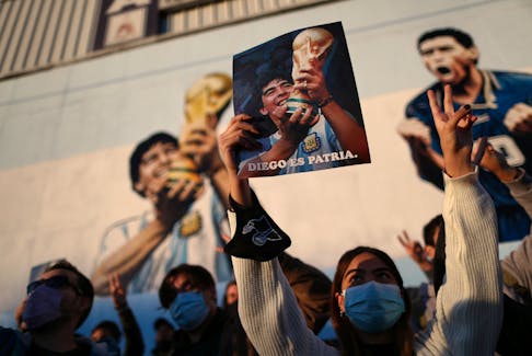A fan of Argentine soccer superstar Diego Armado Maradona celebrates the idol's 35th anniversary of the "goal of the century", against England during the 1986 World Cup played in Mexico, in Buenos Aires, Argentina June 22, 2021.