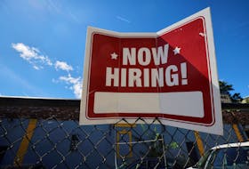 A "now hiring" sign is displayed outside Taylor Party and Equipment Rentals in Somerville, Massachusetts, U.S., September 1, 2022.    