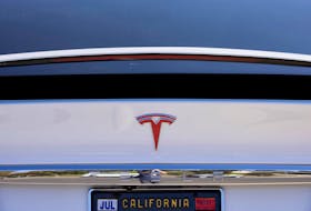 A Tesla Model X is shown at a Tesla service center in Costa Mesa, California, U.S., October 20, 2020.  