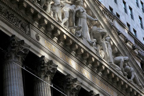 Morning sunlight falls on the facade of the New York Stock Exchange (NYSE) building after the start of Thursday's trading session in Manhattan in New York City, New York, U.S., January 28, 2021.