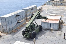 U.S. Navy personnel construct a JLOTS, which stands for "Joint Logistics Over-the Shore" temporary pier which will provide a ship-to-shore distribution system to help deliver humanitarian aid into Gaza, in an undated handout picture in the Mediterranean Sea.  U.S. Central Command/Handout via
