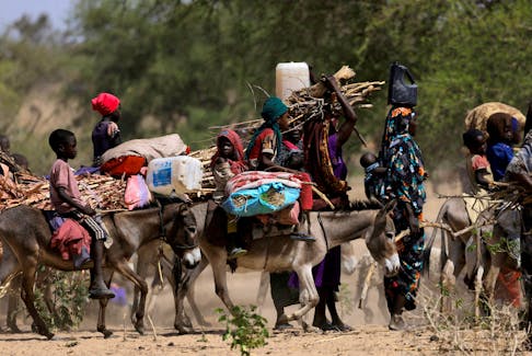 Sudanese refugees who fled the violence in Sudan's Darfur region and newly arrived ride their donkeys looking for space to temporarily settle, near the border between Sudan and Chad in Goungour, Chad May 8, 2023.