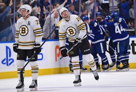May 2, 2024; Toronto, Ontario, CAN; Boston Bruins defenseman Charlie McAvoy (73) and forward John Beecher (19) react as Toronto Maple Leafs players celebrate a goal by William Nylander (88) in the second period in game six of the first round of the 2024 Stanley Cup Playoffs at Scotiabank Arena. Mandatory Credit: Dan Hamilton-USA TODAY Sports