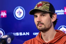 Winnipeg Jets goaltender Connor Hellebuyck meets with media after the players cleaned out their lockers Thursday. KEVIN KING/Winnipeg Sun