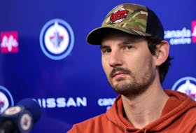 Winnipeg Jets goaltender Connor Hellebuyck meets with media after the players cleaned out their lockers Thursday. KEVIN KING/Winnipeg Sun