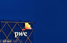 The logo of accounting firm PricewaterhouseCoopers (PwC) is seen on the top of a Brussels' office of the company, in Diegem, Belgium September 21, 2023. 