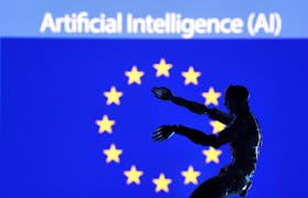 AI Artificial intelligence words, miniature of robot and EU flag are seen in this illustration taken December 21, 2023.