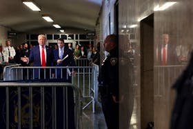 Former U.S. President Donald Trump, joined by his attorney Todd Blanche, speaks to the media as he arrives for his hush money trial at Manhattan Criminal Court in New York, U.S., May 28, 2024. Spencer Platt/Pool via