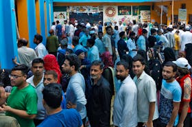People wait in lines to cast their votes at a polling station during the sixth phase of India’s general election in New Delhi, India, May 25, 2024.