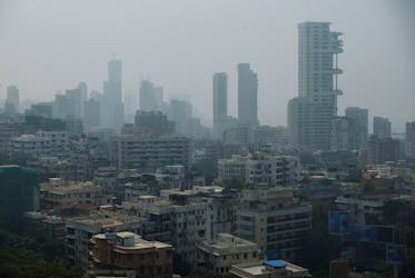 A general view of high-rise residential buildings amidst other residential buildings in Mumbai, India, December 1, 2023.
