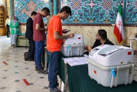 People vote during the runoff parliamentary elections in Tehran, Iran, May 10, 2024. Majid Asgaripour/WANA (West Asia News Agency) via