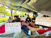 About a dozen foreign workers set up camp outside the George Coles building on May 29 as they launched their dry hunger strike that same day. - Thinh Nguyen • The Guardian