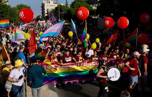 People take part in an annual Pride and Tolerance March, under the slogan "Born to be Free" calling for the swift return of hostages seized during the deadly October 7 attack by Palestinian Islamist group Hamas from Gaza, in Jerusalem, May 30, 2024.