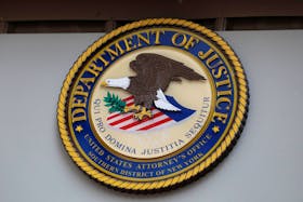The seal of the United States Department of Justice is seen on the building exterior of the United States Attorney's Office of the Southern District of New York in Manhattan, New York City, U.S., August 17, 2020.