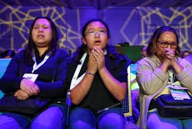 Family members of speller Zachary Rare, a 7th grader from Kentucky, react when he misspells a word in the semifinals of the Scripps National Spelling Bee in National Harbor, Maryland, U.S., May 29, 2024.