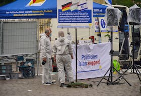 Police investigators work at the scene where a bearded man attacked people at a far right-wing information stand of the Buergerbewegung Pax Europa (BPE) in the central market of the city of Mannheim, Germany, May 31, 2024.