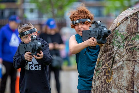 Mason Currie (10) & Cartel Clyke (10), both of Truro take aim during the laser tag provided by Titan Action Sports at the Family Funday at Civic Square. NICK GAINES