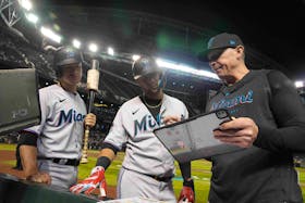May 9, 2023; Phoenix, Arizona, USA; Miami Marlins hitting coach Brant Brown (right) talks with Miami Marlins first baseman Yuli Gurriel (middle) and Miami Marlins shortstop Joey Wendle (left) during the eighth inning of the game against the Arizona Diamondbacks at Chase Field. Mandatory Credit: Joe Camporeale-USA TODAY Sports/File Photo