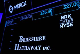 Trading information and logo for Berkshire Hathaway is displayed on a screen on the floor of the New York Stock Exchange (NYSE) in New York City, U.S., May 10, 2023. 