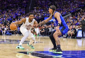 May 3, 2024; Orlando, Florida, USA; Cleveland Cavaliers guard Donovan Mitchell (45) handles the ball against Orlando Magic forward Paolo Banchero (5) during the second half of game six of the first round for the 2024 NBA playoffs at Kia Center. Mandatory Credit: Mike Watters-USA TODAY Sports