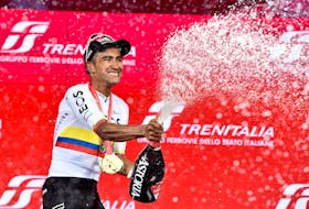 Cycling - Giro d'Italia - Stage 1 - Venaria Reale to Torino - Italy - May 4, 2024 Ineos Grenadiers's Jhonatan Narvaez celebrates spraying champagne on the podium after winning stage 1