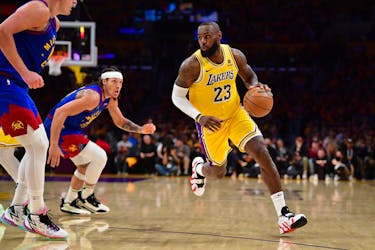 Apr 25, 2024; Los Angeles, California, USA; Los Angeles Lakers forward LeBron James (23) moves the ball against Denver Nuggets center Nikola Jokic (15) and forward Aaron Gordon (50) during the second half in game three of the first round for the 2024 NBA playoffs at Crypto.com Arena. Mandatory Credit: Gary A. Vasquez-USA TODAY Sports/File Photo