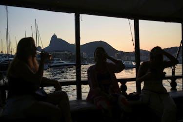 People sit on a boat to attend Madonna's concert, in Rio de Janeiro, Brazil May 4, 2024.