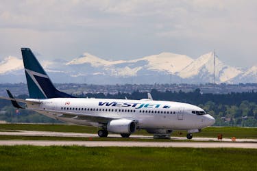 A Westjet airline plane lands at the Calgary International Airport in Calgary, Alberta, June 17, 2008.