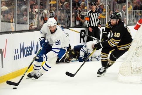 May 4, 2024; Boston, Massachusetts, USA; Toronto Maple Leafs center John Tavares (91) controls the puck ahead of Boston Bruins center Pavel Zacha (18) during the third period in game seven of the first round of the 2024 Stanley Cup Playoffs at TD Garden. Mandatory Credit: Bob DeChiara-USA TODAY Sports