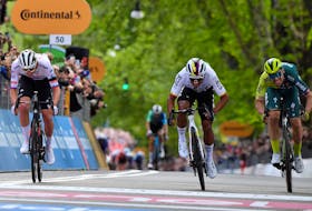 Cycling - Giro d'Italia - Stage 1 - Venaria Reale to Torino - Italy - May 4, 2024 Ineos Grenadiers's Jhonatan Narvaez crosses the finish line to win stage 1 followed by UAE Team Emirates' Tadej Pogacar