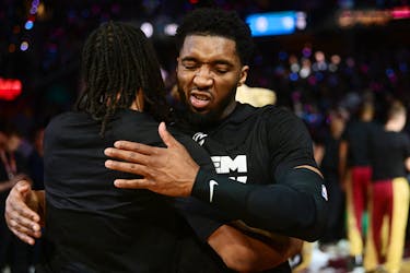 May 5, 2024; Cleveland, Ohio, USA; Cleveland Cavaliers guard Donovan Mitchell (45) hugs guard Darius Garland (10) during introductions before game seven of the game between the Cavaliers and the Orlando Magic of the first round for the 2024 NBA playoffs at Rocket Mortgage FieldHouse. Mandatory Credit: Ken Blaze-USA TODAY Sports