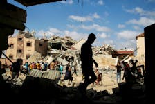 Palestinians inspect the site of an Israeli strike on a house, amid the ongoing conflict between Israel and Hamas, in Rafah, in the southern Gaza Strip May 5, 2024.