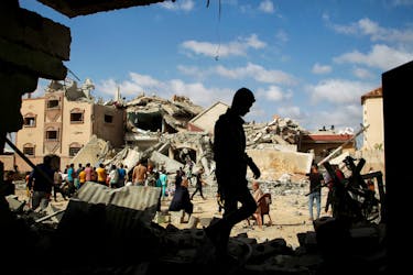 Palestinians inspect the site of an Israeli strike on a house, amid the ongoing conflict between Israel and Hamas, in Rafah, in the southern Gaza Strip May 5, 2024.