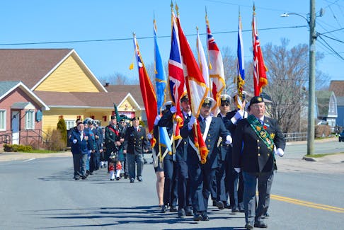 Cape Breton Naval Veterans Association master-at-arms David Keeping, right, leads the colour guard during the Battle of the Atlantic in Sydney Mines on Sunday. The battle lasted throughout the Second World War and more than 4,300 members of the Royal Canadian Navy, Royal Canadian Air Force and Canadian Merchant Navy were killed trying to control the Atlantic Ocean against German forces. The Battle of the Atlantic also brought the Second World War to Canada’s doorstep, with German submarines torpedoing ships within sight of the coast, including the SS Caribou, a passenger ferry that ran between North Sydney and Port aux Basques, Newfoundland. On Oct. 14, 1942, a U-boat sank the vessel, causing the worst loss of life in Canadian waters during the Second World War. Of the 237 people onboard, 167 were killed, including several mothers with children. The Battle of the Atlantic is recognized on the first Sunday in May in Canada. CHRIS CONNORS/CAPE BRETON POST