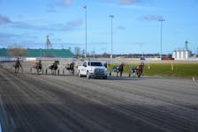 The horses line up behind the starting gate at Red Shores Racetrack and Casino at the Charlottetown Driving Park on May 4. The first live card of the spring meet featured 12 dashes. Jason Simmonds • The Guardian