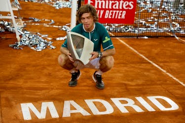 Tennis - Madrid Open - Park Manzanares, Madrid, Spain - May 5, 2024  Russia's Andrey Rublev poses with the trophy after winning his final match against Canada's Felix Auger Aliassime