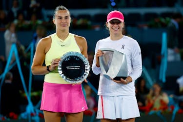 Tennis - Madrid Open - Park Manzanares, Madrid, Spain - May 4, 2024 Poland's Iga Swiatek poses with the trophy and with runner up Belarus' Aryna Sabalenka after winning the final match