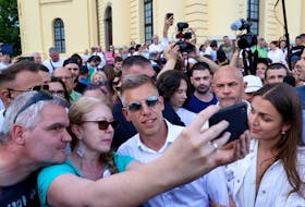 Peter Magyar, former government insider and leader of the Respect and Freedom (TISZA) Party, poses for a picture with his supporters during an anti-government protest in Debrecen, Hungary, May 5, 2024.