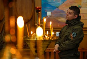 A Ukrainian serviceman attends an Orthodox Easter service in the town of Kostiantynivka, amid Russia's attack on Ukraine, near a front line in Donetsk region, Ukraine May 5, 2024.