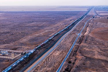 A drone picture of a line of trucks waiting on an Egyptian road along the border with Israel, near the Rafah border crossing with the Gaza Strip May 2, 2024.