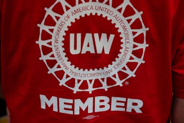 A person wearing a T-shirt that has "UAW member" written on it is pictured as the result of a vote comes in favour of the hourly factory workers at Volkswagen's assembly plant to join the United Auto Workers (UAW) union, during a watch party in Chattanooga, Tennessee, U.S., April 19, 2024. 