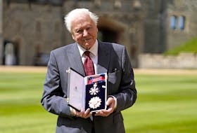 Sir David Attenborough poses for a picture after being appointed as Knight Grand Cross of the Order of St. Michael and St. George, following an investiture ceremony at Windsor Castle, Windsor, Britain June 8, 2022. Andrew Matthews/Pool via
