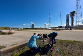 Photographers work on remote cameras at Launch Complex 41 in preparation for the launch of Boeing's Starliner-1 Crew Flight Test (CFT), in Cape Canaveral, Florida, U.S., May 4,, 2024.